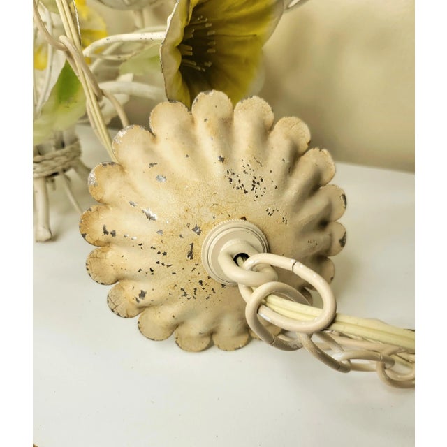 This vintage Italian tole is sunny and bright. This piece measures 18" tall and 18" wide with 5 candelabra sockets that...