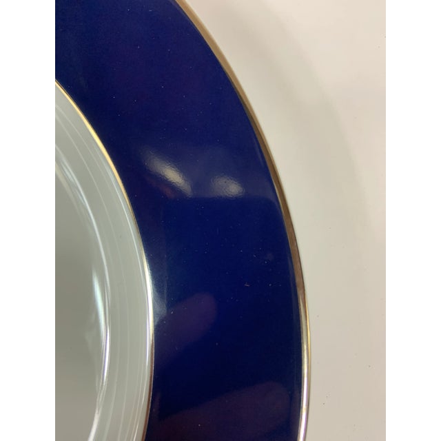 Set of 6 blue and white Bernardaud Limoges chargers. Platinum accent rim