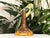 A vibrant, vintage Italian ceramic parrot figurine, beautifully hand-painted with bright mid-century tropical flair. The...