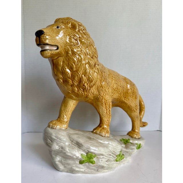 Here is a wonderful vintage ceramic lion figurine, likely dating to the mid-20th century, notable for its generous size...