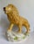 Here is a wonderful vintage ceramic lion figurine, likely dating to the mid-20th century, notable for its generous size...
