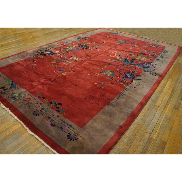 1920s Coral Hand Knotted Pile Antique Rectangle Wool Rug, Circa Date: 1920s. This exceptional piece exemplifies the...