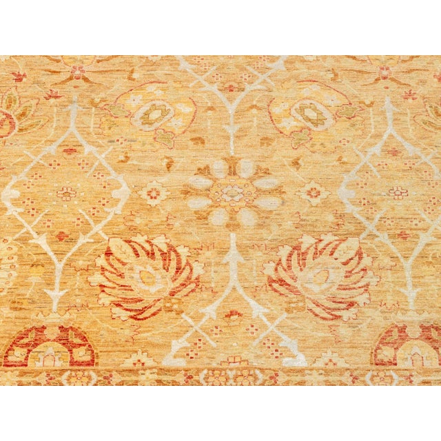 Afghan Tabriz Style Wool and Silk Blend Carpet, cream with russet designs, Marc Phillips label to underside. 17' 6" L x...