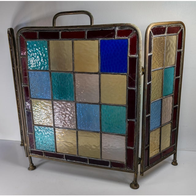 We are selling this great colorful Arts & Crafts fire screen. This fire screen has beautiful colored stained glass mosaic...
