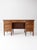 An early 20th century oak double pedestal desk with a grounded presence and clean Arts and Crafts movement lines. the form...