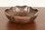 A gorgeous Arts & Crafts hand hammered copper flower form fruit bowl or center bowl with ruffled edges In the manner of...