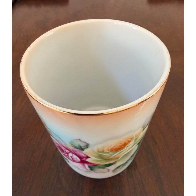 Charming vintage porcelain cachepot or small decorative vessel with matching plate featuring lush pink and creamy yellow...
