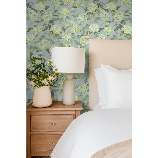 Our Hydrangea Blooms Botanical Wallpaper began as a hand-painted watercolor, with each petal added one by one to capture...