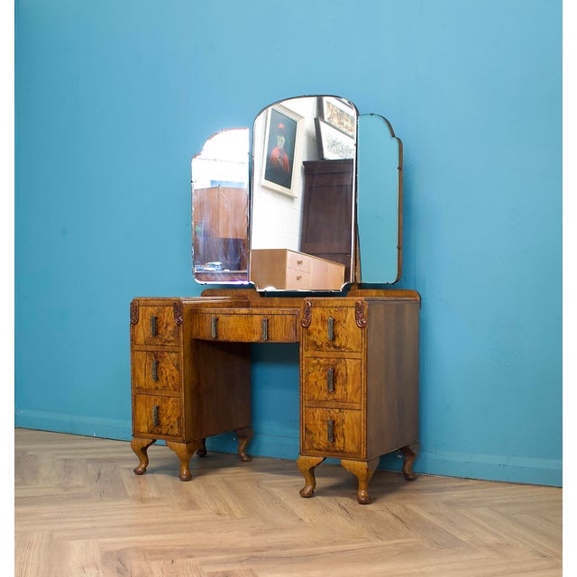 Burr walnut dressing table with a bold grain across the drawers and top. Six drawers with a central drawer, all fitted...