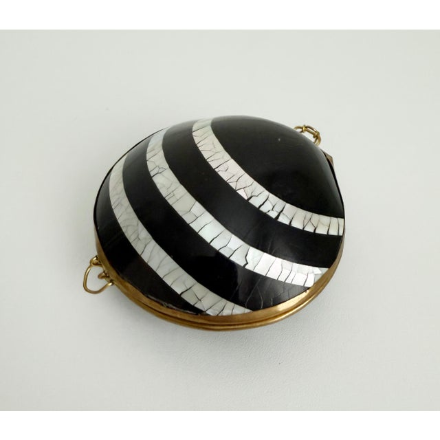 Rare natural clam shell ring box featuring small, intricately inlaid lacquered abalone shell and black shell. Each half is...