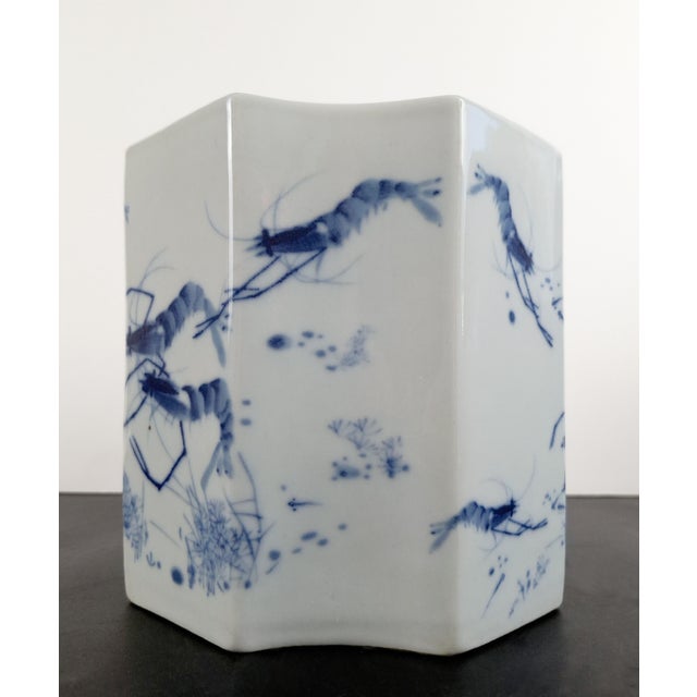 Chinese porcelain Qinghua xia bitong, a finely formed, eight-faced brushpot with concave sides alternating with flat...