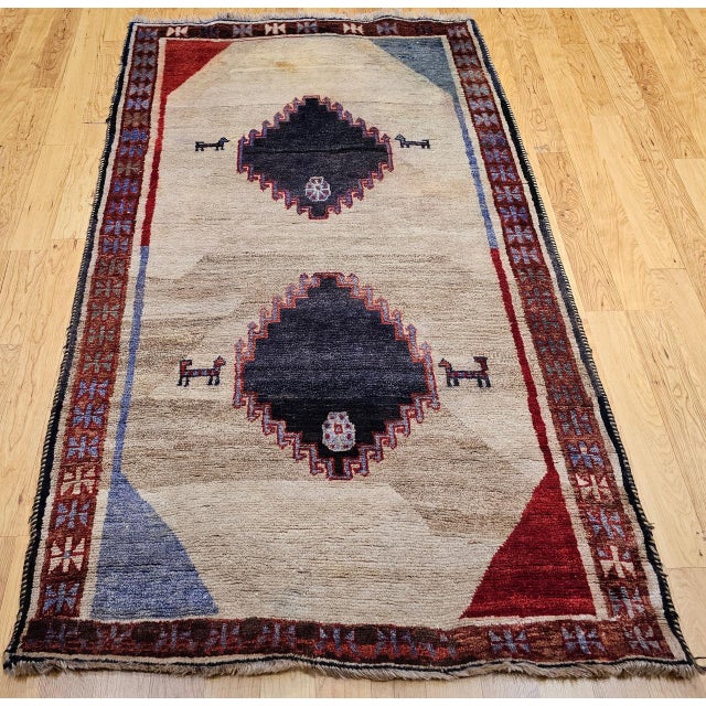 "A beautiful vintage Persian Gabbeh area rug — a textile that occupies a unique place in the Persian rug world as the most...
