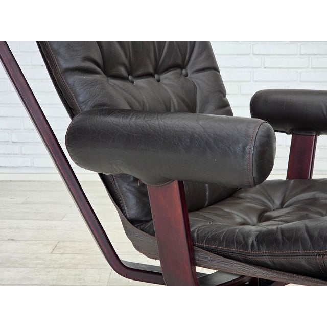 1970s, Norwegian design by Sigurd Ressel, model "Falcon" (model with armrests). Original brown furniture leather, canvas,...