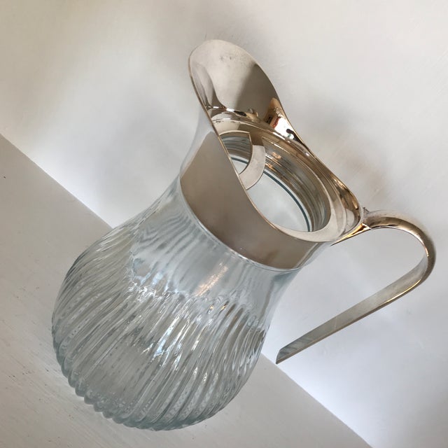 Godinger Crystal Pitcher With Removable Silver Plated Pour ... The spout must be removed for pouring.