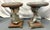 Spectacular pair of figural putti garden stools from the mid 20th century. The playful putti are positioned with one bent...