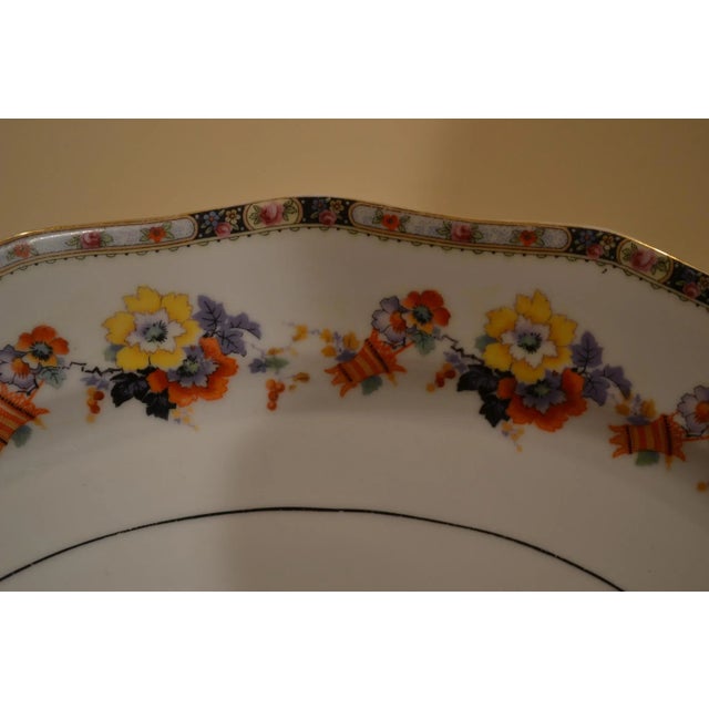 Beautiful German oval serving dish Colorful floral design on edges and interior of dish Gold trim on outer edges of dish...