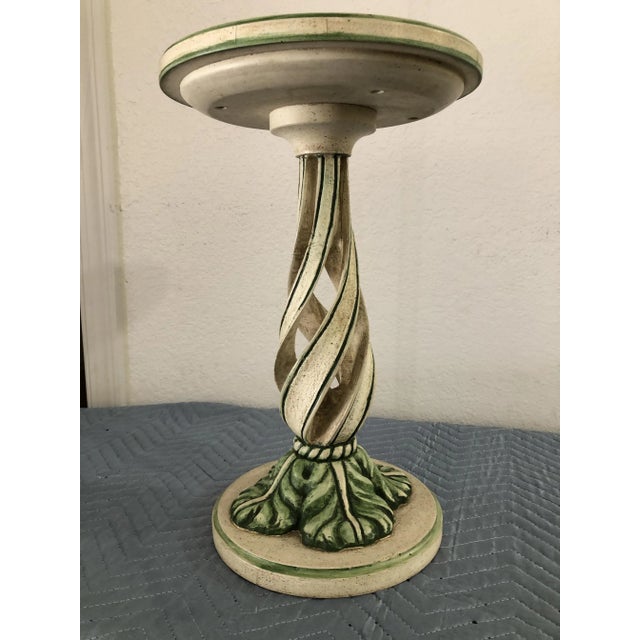 A sweet little side table antique beige finish with green accents. 19' high x 12" diameter. How cute is this?