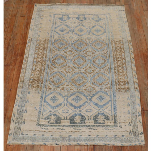 Persian Balouch Accent Size rug from the 2nd quarter of the 20th century in blue, brown and sand tones Measures: 3'11'' x...