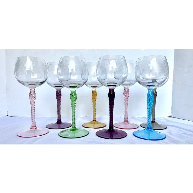 Rare set of eight (8) mid-century harlequin wine glasses. Dating to circa 1960, this colorful collection brings an...