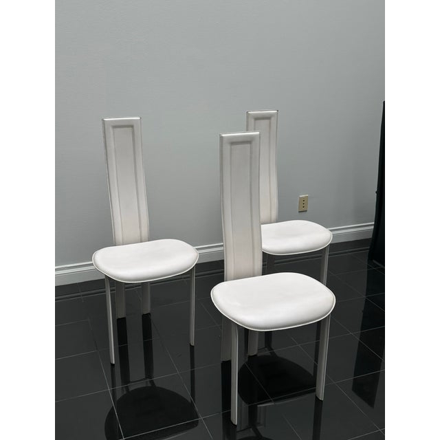 Italian contemporary dining chairs by Cattelan Italia, designed by Paolo Cattelan. Featuring a fully upholstered steel...