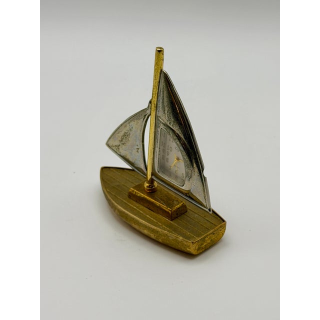 Add a touch of nautical charm to your shelf or desk with this vintage Elgin sailboat desk clock. Crafted in a classic...