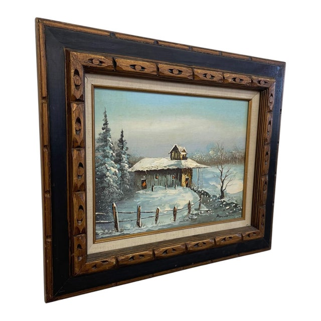 Vintage signed oil painting on canvas depicting a snow-covered rural landscape with a rustic cabin, split-rail fence, bare...