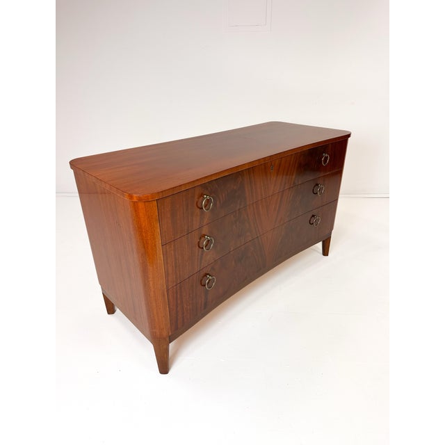 1940's Swedish Dresser By AB Seffle Möbelfabrik. Three drawer curved dresser. Mahogany.
