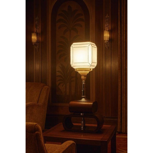 A distinctive danish mid-century modern table lamp dating to circa 1960, combining sculptural proportions with the warm...