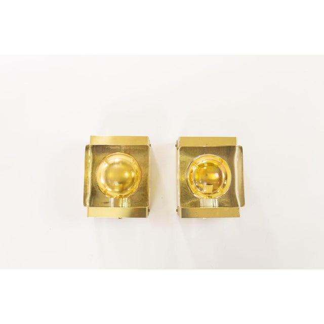 A set of two rare gold Maritim Lampet wall lamps, produced by Danish lighting manufacturer Vitrika in the 1970s. Both...
