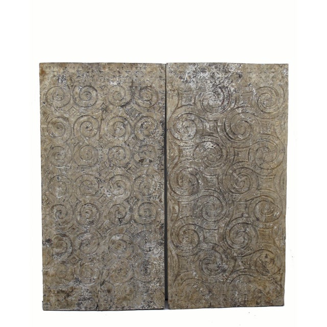 The primitive traditional Toraja art patterns are hand carved on the reclaimed wood panels. This pair of earthy tone...