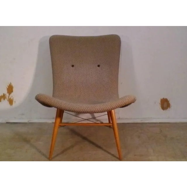 Lounge chair was designed in the 1950s by Miroslav Navratil for Cesky Nabytek in former Czechoslovakia. The shell seats...