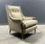 A stunning high back lounge chair by Jamestown Royal with its beautiful brass accented armrest joints and brass sabot...