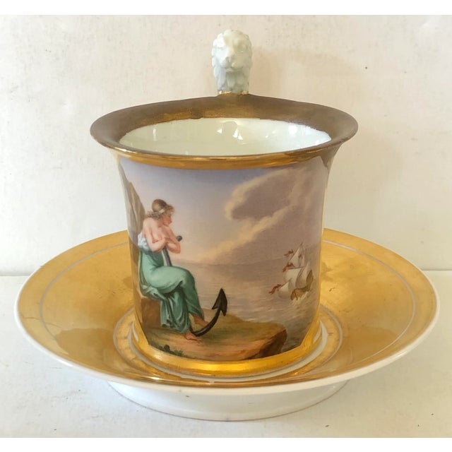 Antique Austrian Royal Vienna porcelain cup and saucer from the early 19th century. This lovely set is finely hand painted...