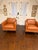 A striking pair of architectural lounge chairs showcasing the clean lines and disciplined geometry associated with classic...