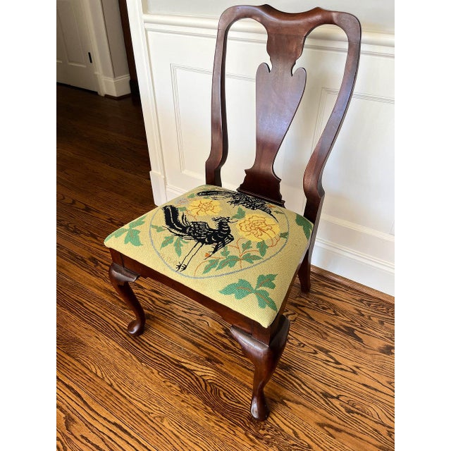 This charming mid-century mahogany side chair features a custom needlepointyed seat signed with the artist's initials. The...