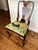 This charming mid-century mahogany side chair features a custom needlepointyed seat signed with the artist's initials. The...
