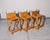 A distinctive set of three handcrafted oak counter stools by John M. Toy, each bearing the maker's branded stamp. These...
