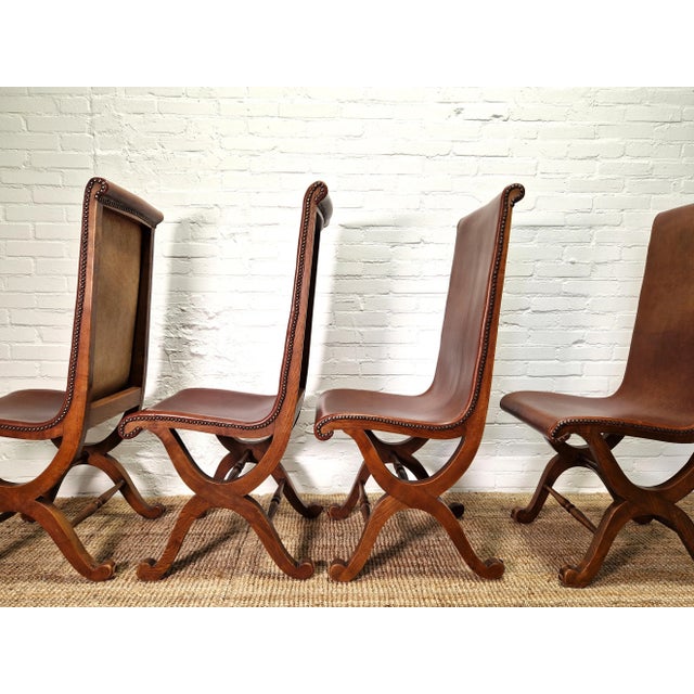 This set of four neo-classical high back slipper chairs was designed by Pierre Lottier and made by Spanish company...