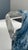 A beautiful decorative carafe in blown glass, its deep blue body streaked with white veins and clouds that create a...