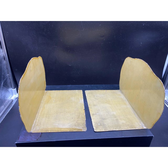 These have been in my family as long as I can remember. My grandmother used them to hold her cookbooks in a butlers...