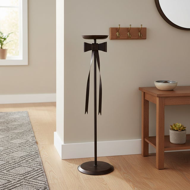 The Art of Welcome: The Iron Ribbon Pedestal Make every entrance memorable with this unique Hand-Forged Wrought Iron...