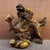 A striking Chinese bronze sculpture featuring a dynamic dragon perched atop a treasure basin. The dragon is intricately...