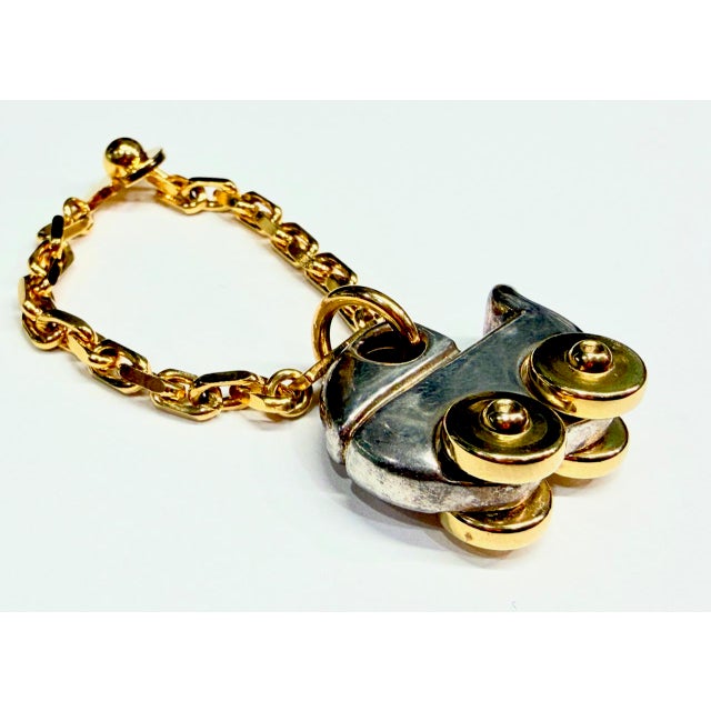 The pendant does not bear a silver purity hallmark. It has been tested using a spectrometer. It is of low silver purity,...
