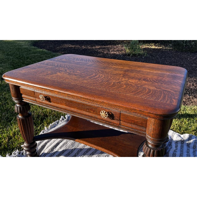 Beautiful antique tiger oak library table made by Bailey, Jones & Co. of Jamestown, New York, a historic furniture maker...