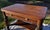 Beautiful antique tiger oak library table made by Bailey, Jones & Co. of Jamestown, New York, a historic furniture maker...