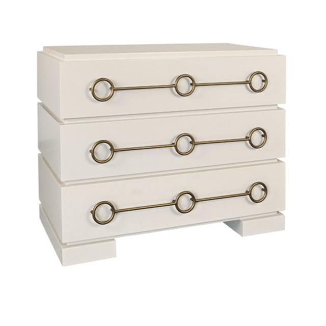 New special order item. Not vintage. The elegant Roderick three-drawer chest crafted in matte antique white lacquer with a...
