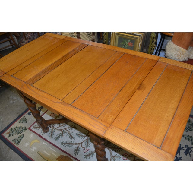 This is a great English pub/tavern table. I believe it dates from the early 1900's & has variations in the oak color....