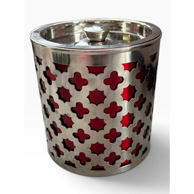 Striking vintage Cynthia Rowley ice bucket featuring a polished chrome finish with a bold red lattice overlay. Compact...