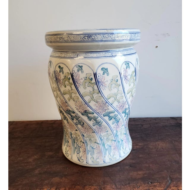 Vintage Chinoiserie style ceramic garden stool with a delicate floral design in blue, pale green, and pink. Features...