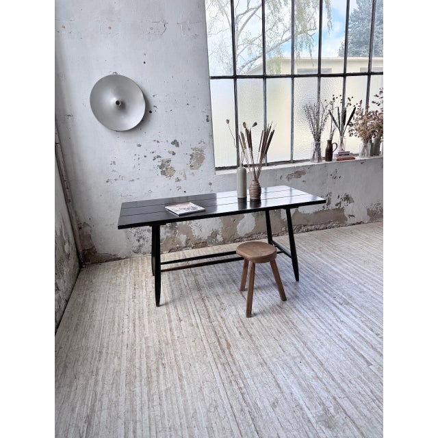 Vintage dining table by Tapiovaara, with its beautiful black patina from the 1950s. The legs and crossbars are beautifully...